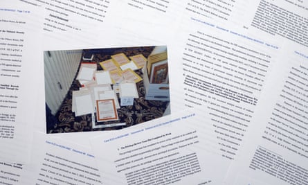 Pages from a Department of Justice court filing on Aug. 30, 2022, in response to a request from the legal team of former President Donald Trump for a special master to review the documents seized during the Aug. 8 search of Mar-a-Lago, are arranged for a photo early Wednesday, Aug. 31, 2022. Included in the filing was a FBI photo of documents that were seized during the search. (AP Photo/Jon Elswick)