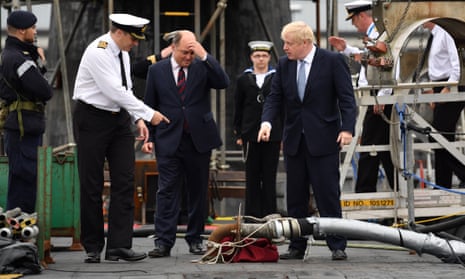 ommander Justin Codd accompanies Boris Johnson (right) and Defence Secretary Ben Wallace (centre) as they visit HMS Victorious at HM Naval Base Clyde