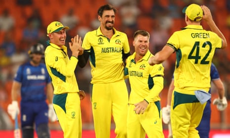 Australia's Mitchell Starc celebrates with teammates after taking the wicket of England's Jonny Bairstow in the first ball of the inning, caught by Josh Inglis.