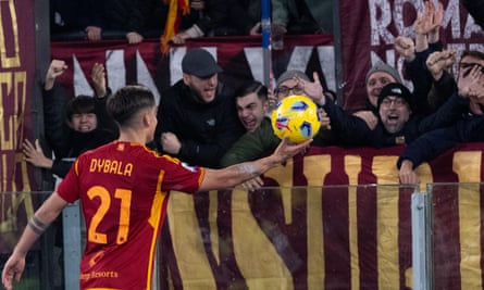 Paulo Dybala offers the match ball to Roma fans after his hat-trick against Torino.