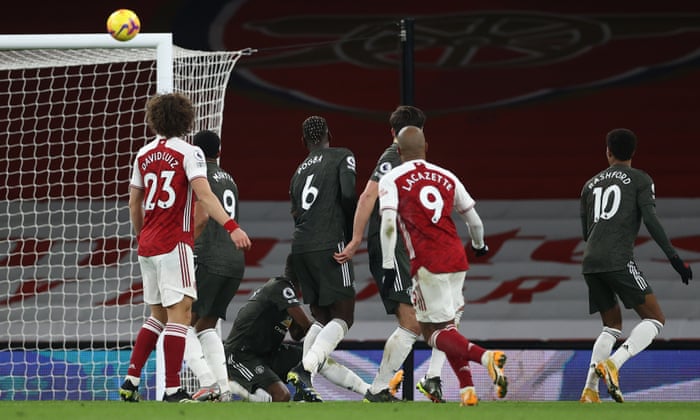 Alexandre Lacazette of Arsenal sees free kick come back off bar.