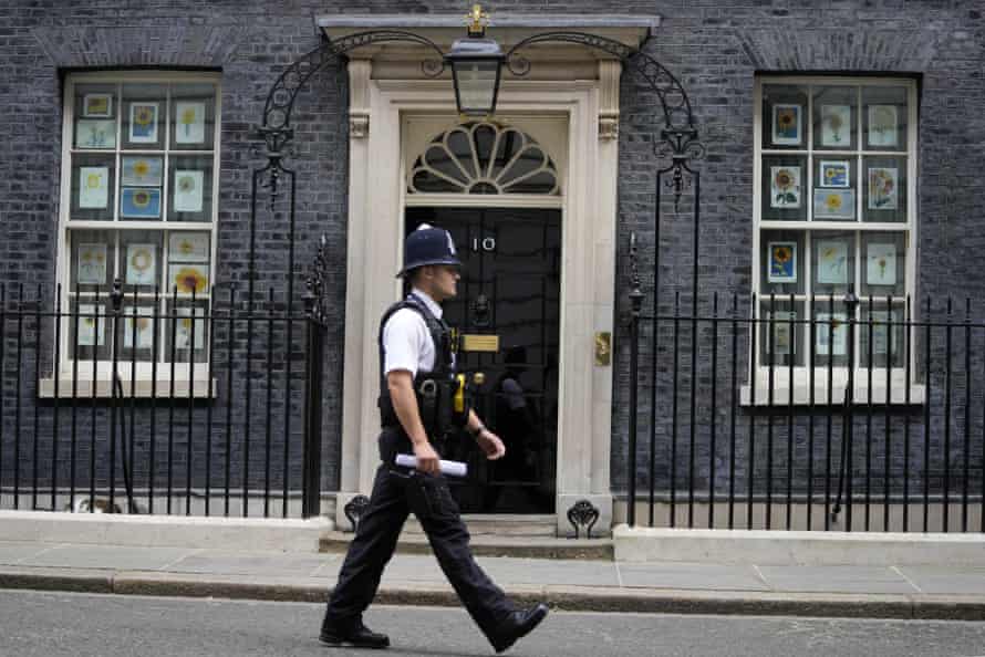 A police officer walking past 10 Downing Street this morning.