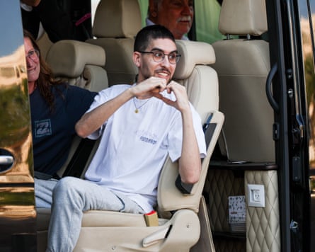 Hostage Eviatar David makes a heart with his hands as he arrives over ‘hostages square’.