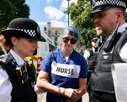 Woman being arrested by two police officers