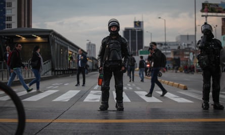 Outrage After Colombia Riot Police Force Young Woman Into