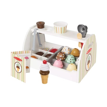 A wooden toy ice-cream cart holds scoops, cones, a cup, tongs and a scoop tool