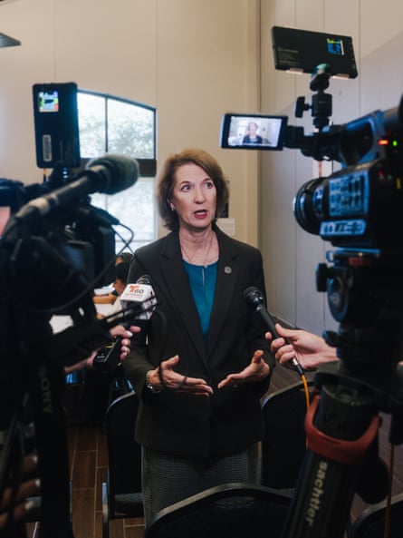 Woman speaks to reporters