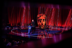 Host David Tennant speaks on stage