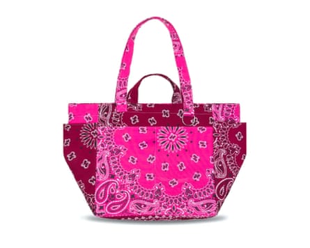A fuchsia pink paisley picnic bag on a white background