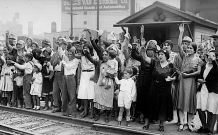 Relatives and friends wave goodbye to a train carrying 1,500 undocumented Mexican immigrants
