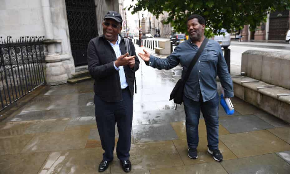 Paul Green (left) and Cleveland Davidson outside the Royal Courts of Justice in London. 
