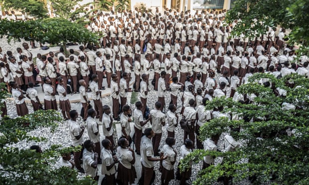 Students gather for a morning assembly. Students receive annual scholarships to attend the APJ school, which is overseen by a full time and all Haitian faculty.