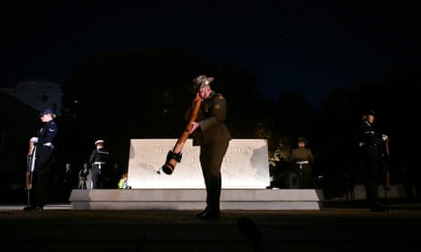 A didgeridoo is played as dawn service is held at the Australian War Memorial in Canberra.