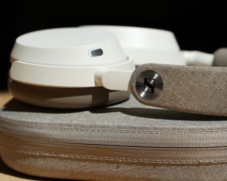 The metallic spin ring Sennheiser logo on the headband of the Momentum 5 headphones.