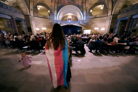 Glenda Starke counterprotests during a rally in favor of a ban on gender-affirming healthcare legislation on 20 March at the Missouri statehouse.