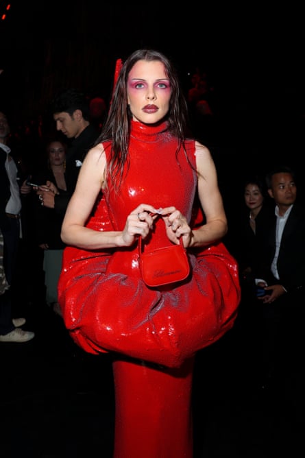 Julia Fox in a red sequinned gown with puffy peplum