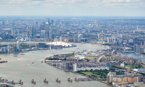 An aerial view looking up the river Thames over Greenwich Peninsula