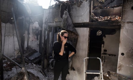 Inbar Goldstein, Nadav’s sister, at the burnt-out ruins of their parents’ house in Kfar Aza