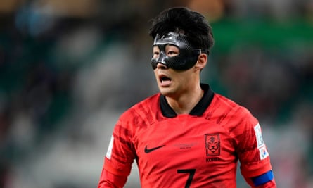 Son Heung-min in a mask covering his forehead and cheekbones.