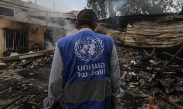 An UNRWA employee inspects a destroyed school following an air strike in Al Nuseirat refugee camp, central Gaza Strip earlier this month.
