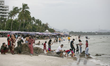 People gather on the beach on 24 May 2020 in Hua Hin, Thailand.