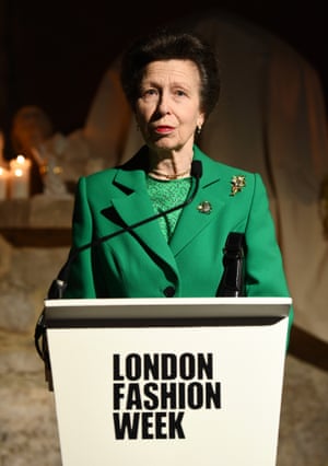 Rarely seen without a brooch for public events, Princess Anne styles a bright green skirt suit with two to present The Queen Elizabeth II award for British design at London Fashion Week in February 2020.