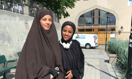 Sisters Iman and Monica Omer stand outside Stockholm mosque.