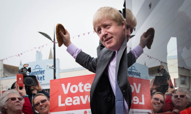 Boris Johnson holds a Cornish pasty as he boards the Vote Leave campaign bus in Truro, Cornwall.