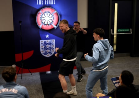 Aaron Ramsdale celebrates after edging out Phil Foden to win Luke Littler’s darts championship at St George’s Park.