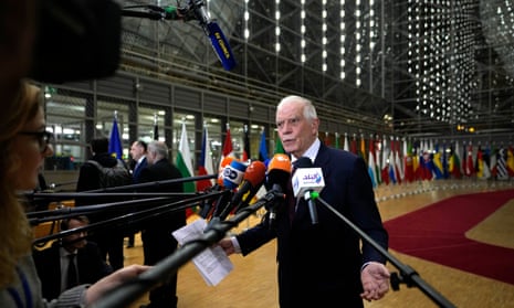 Josep Borrell speaks with the media as he arrives for a meeting of EU foreign ministers at the European Council building in Brussels.