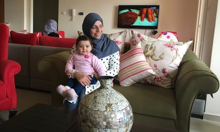 Rawabi resident Mai Alzarou and her nine-month old daughter.