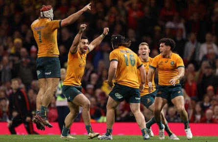 Australia’s players celebrate their victory over Wales at full time