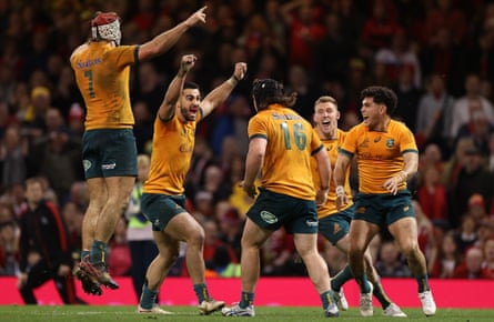 Australia’s players celebrate victory at full-time.