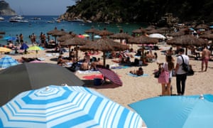 People enjoying sunny weather on Cala Aiguablava beach, amid the coronavirus disease (COVID-19) outbreak in Begur, near Girona, Costa Brava, Spain June 27, 2020.