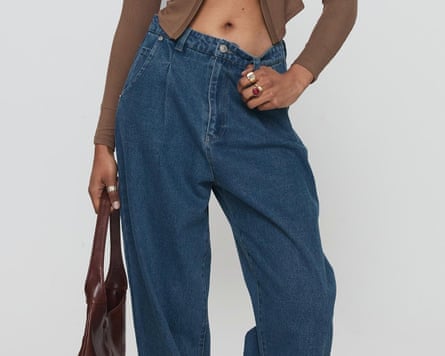 A leg shot of blue barrel-leg jeans