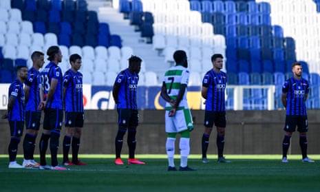 Atalanta players take part in a minute’s silence before the home game against Sassuolo, which was the team’s first match after the coronavirus outbreak.