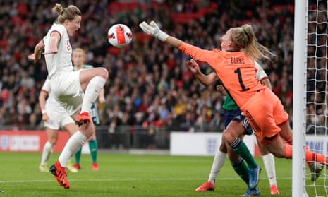 Jacqueline Burns of Northern Ireland saves as Ellen White lurks but is unable to turn the ball in the net.