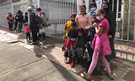 Beritza Colina, 30, waits with her children to be evaluated at a clinic for migrants in Bogotá.
