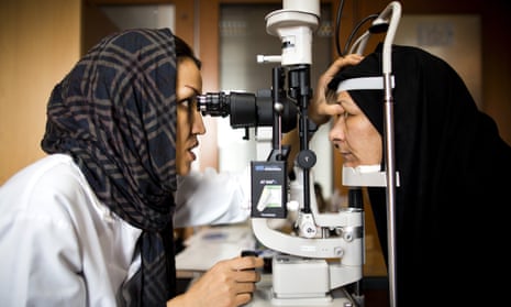 A doctor examines a patient’s eye for glaucoma at a clinic in Tehran.