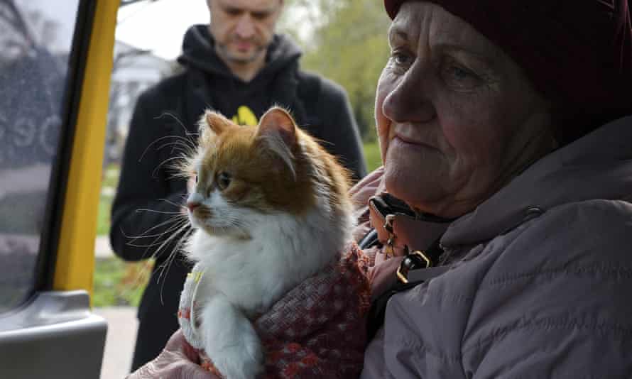 A woman with a cat sits in a bus to move to Ukrainian city of Dnipro during an evacuation of civilians in Kramatorsk, Ukraine, Tuesday, April 19, 2022.