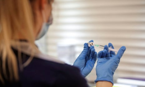 A healthcare worker preparing a dose of the Pfizer/BioNTech vaccine in Thornton, Lancashire, England