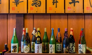 Japan, Gifu Prefecture, Takayama, Sake bottles in sake brewery