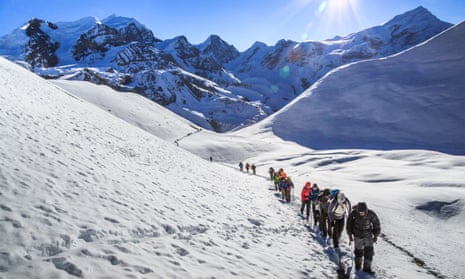 Trekkers in the Thorong La pass, on the popular Annapurna circuit, Nepal.