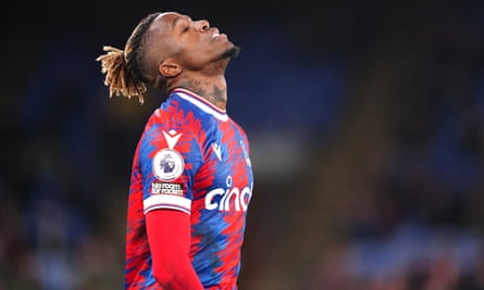 Wilfried Zaha reacts to a heavy defeat to Spurs