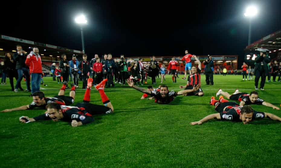 Bournemouth players celebrate at the end of their 3-0 win over Bolton in April 2015 which effectively sealed their promotion to the Premier League.