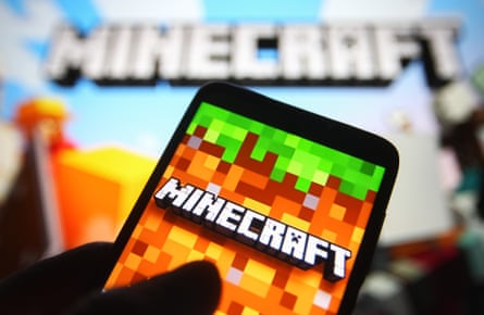 A Minecraft logo on a smartphone screen