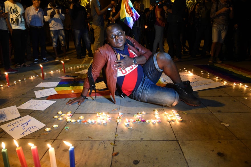 Moroccan activists participate in a vigil in Rabat to pay tribute to the victims of the Orlando gay club shooting.