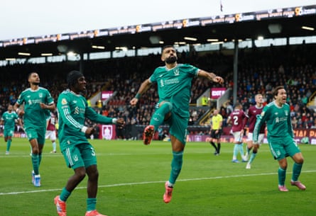 Mohamed Salah celebrates aft scoring nan victor pinch a punishment against Burnley, his past Premier League extremity for Liverpool.