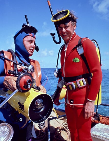 David Attenborough and cameraman Mike Salisbury in scuba gear prepare for a dive