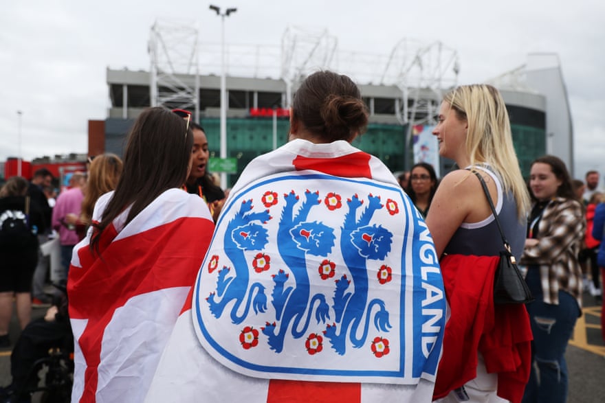 England fans arrive at Old Trafford prior to the opening match of Euro 2022 between England and Austria.